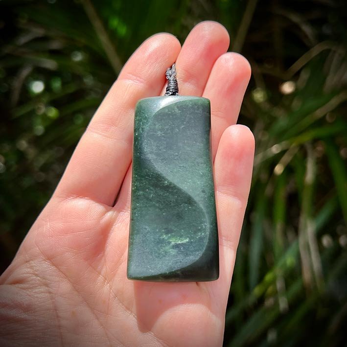 jade pebble auckland showing pounamu greenstone necklace