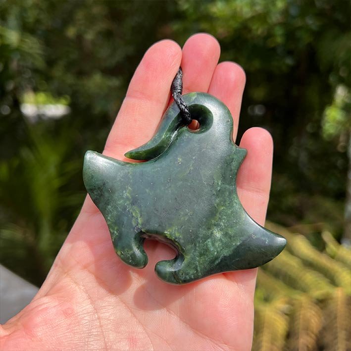 Pounamu necklace in hand of Eszter Jade Pebble Auckland
