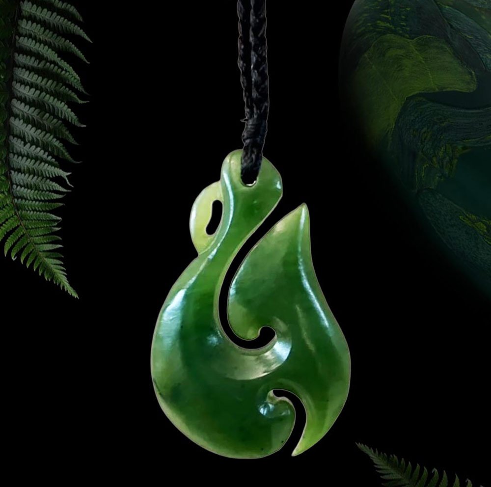 Hei matau with koru pounamu pendant, fish hook combined with a spiral design