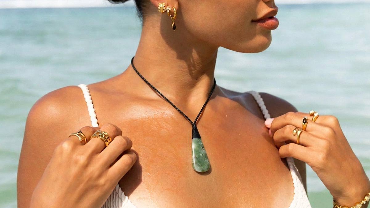 Person wearing a pounamu greenstone necklace