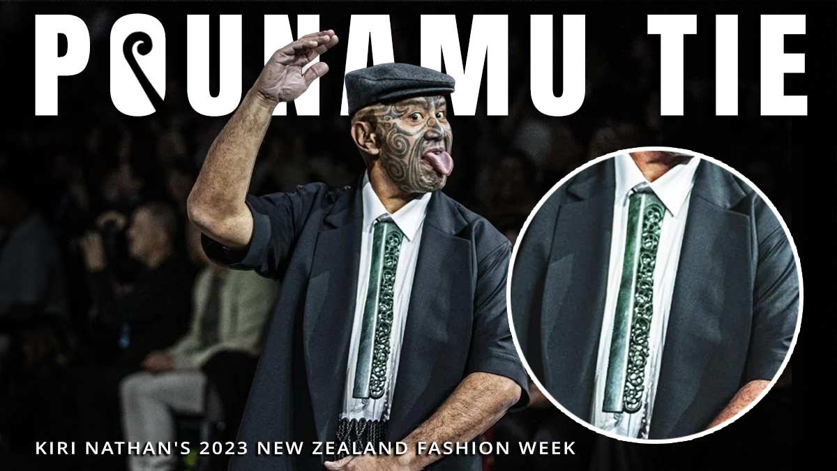 Rawiri Waititi wearing a pounamu tie on the runway at Kiri Nathan's 2023 New Zealand Fashion Week show