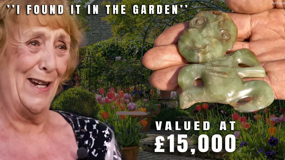 The garden's owner and appraiser Ronnie Archer-Morgan examining the Māori hei-tiki on Antiques Roadshow