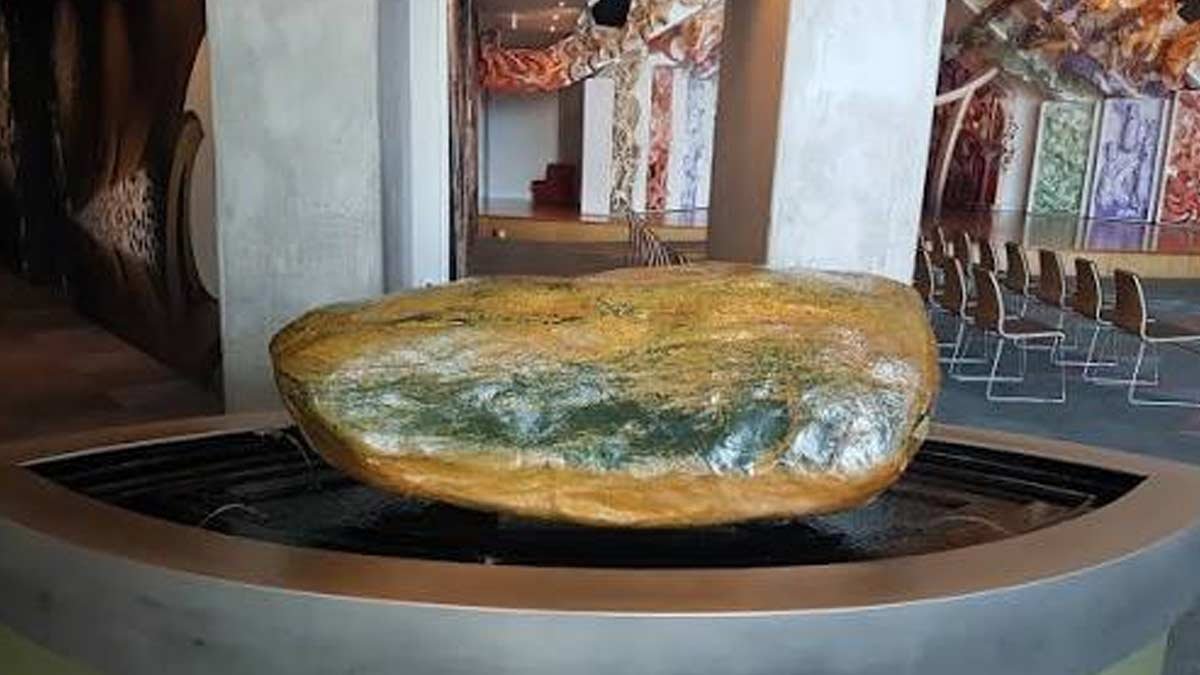 The Mauri pounamu boulder in its fountain display at Te Papa