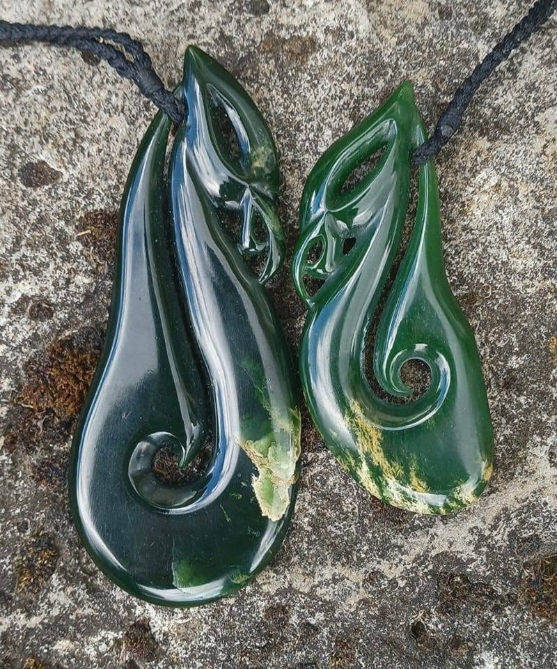 two pendants made from pounamu greenstone
