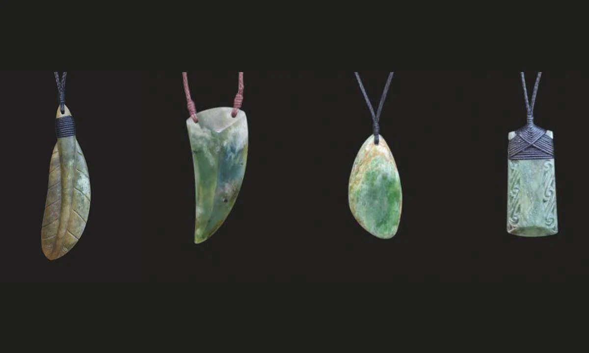 Four pounamu pendants on cords: a feather, a mako tooth, a drop and a lashed toki, carved by Shane MacIntosh