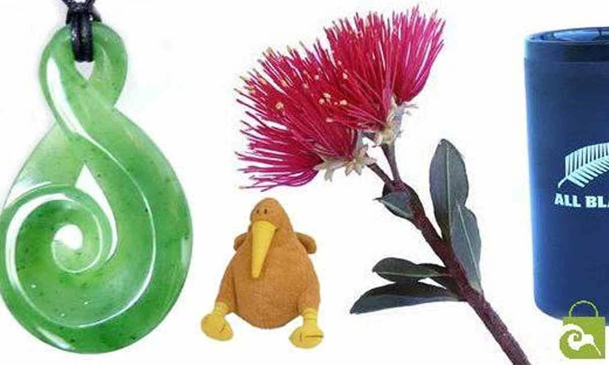ShopNZ banner with a green twist pendant, a kiwi soft toy, a pōhutukawa flower and All Blacks merchandise