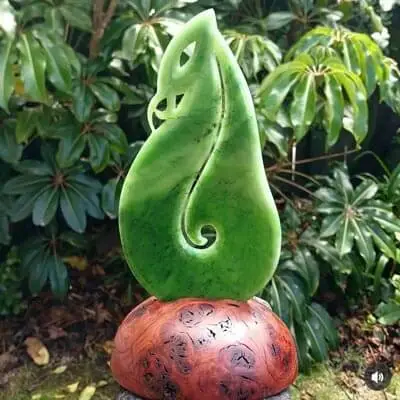 greenstone pounamu statue in garden
