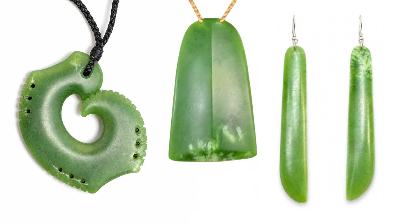 Three pieces in rare Tahutahi pounamu: a matau with perforated edges, a contemporary toki and long drop earrings showing white flecks